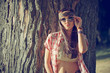 Photo: Beautiful hippie girl near tree Beautiful hippie girl near tree