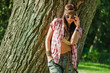 Photo: Beautiful hippie girl near tree Beautiful hippie girl near tree