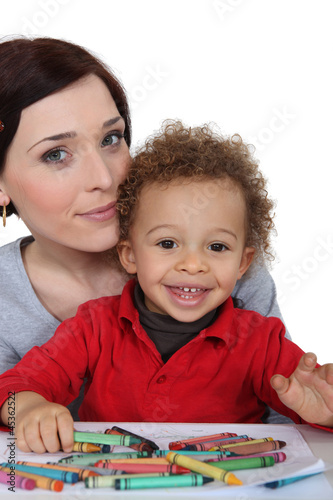 Photo: Woman hugging her cute baby Woman hugging her cute baby