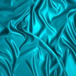 Green silk cloth with folds.