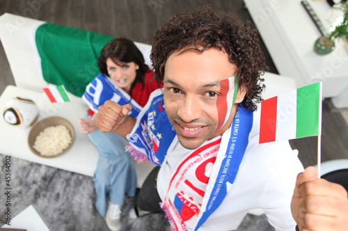 Photo: Couple supporting the Italian national team Couple supporting the Italian national team