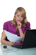 Businesswoman concentrating whilst reading document