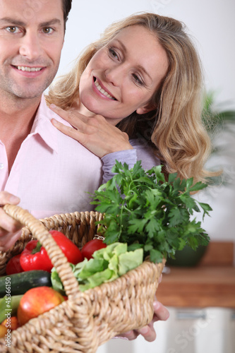 Photo: Couple with vegetable basket Couple with vegetable basket