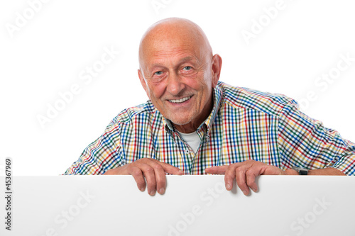 Photo: Senior hält Werbeschild Senior hält Werbeschild