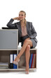 Businesswoman sitting on a storage unit