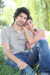 Couple sitting on grass