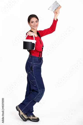 Photo: Woman holding a pail and a scraper Woman holding a pail and a scraper
