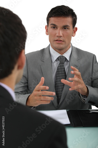 Photo: Businessman explaining something to a colleague Businessman explaining something to a colleague