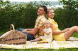 Happy family picnicking outdoors