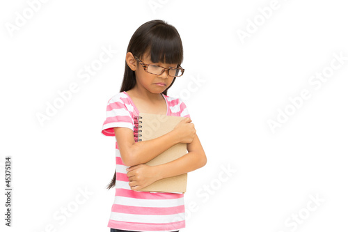 Photo: Sad little girl, Unhappy because fail an exam, Isolated on white Sad little girl, Unhappy because fail an exam, Isolated on white