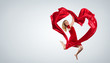 Dancing young woman with flying fabric