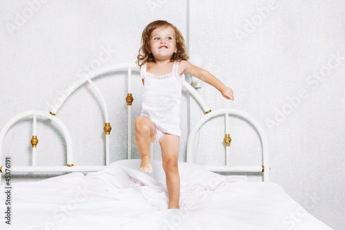 Photo: Toddler dancing in bed Toddler dancing in bed