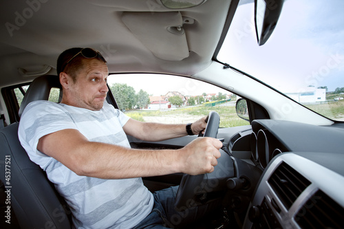 Photo: Man driving car , speeding fast. Man driving car , speeding fast.