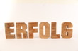 ERFOLG text animation with wooden letter version 1