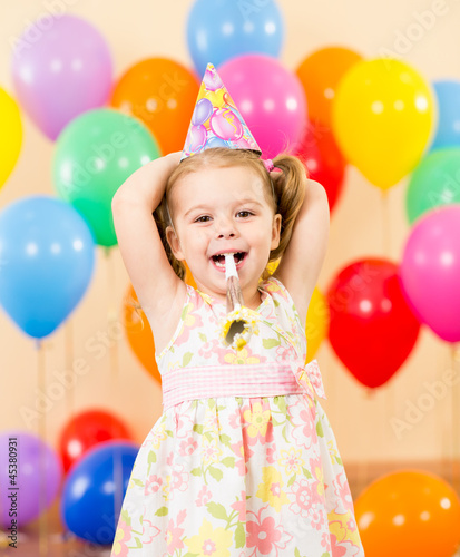 Photo: pretty joyful kid girl on birthday party pretty joyful kid girl on birthday party