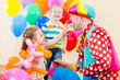 happy children and clown on birthday party