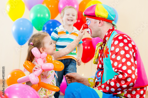 Photo: happy children and clown on birthday party happy children and clown on birthday party