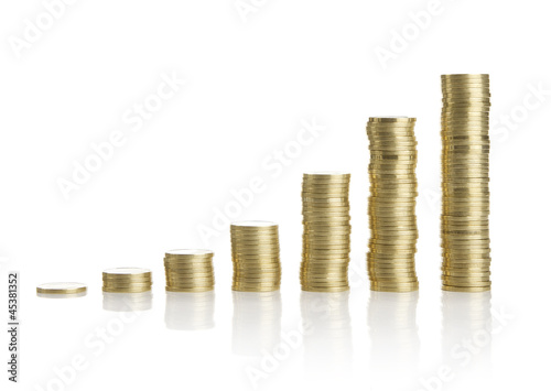 Photo: Golden coins isolated on white background Golden coins isolated on white background