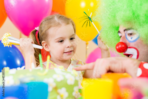 Photo: happy child girl with clown on birthday party happy child girl with clown on birthday party