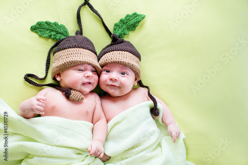 Photo: two twins brothers babies weared in acorn hats two twins brothers babies weared in acorn hats