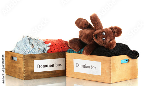 Photo: Donation boxes with clothing isolated on white Donation boxes with clothing isolated on white