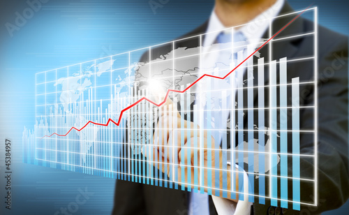 Photo: Businessman touching digital graphic concept Businessman touching digital graphic concept