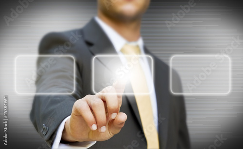 Photo: Businessman touching digital screen Businessman touching digital screen