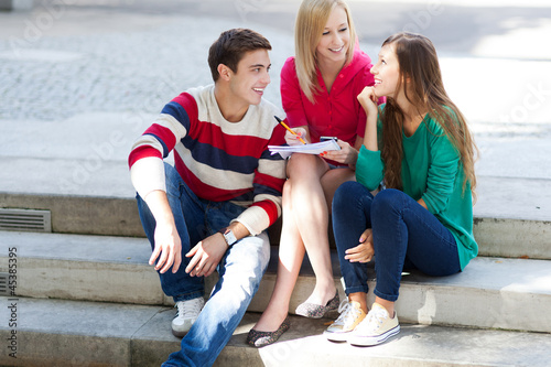 Photo: Three students sitting together Three students sitting together