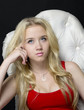 Young woman dreaming in armchair