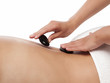 Hot stones are placed on a back - isolated