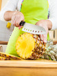 Photo: Woman's hands cutting pineapple Woman's hands cutting pineapple