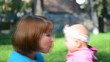 Happy Mother and her baby girl play outdoor