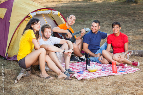 Photo: Group of People Camping and Singing Group of People Camping and Singing