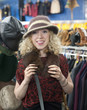 hat shopping in a thrift store