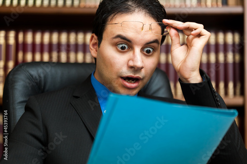 Photo: Surprised chiarman looking at some documents Surprised chiarman looking at some documents