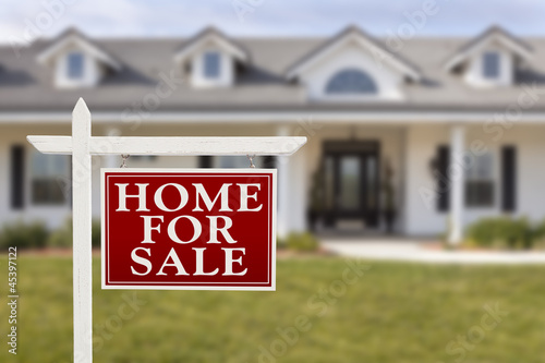 Photo: Home For Sale Real Estate Sign in Front of New House Home For Sale Real Estate Sign in Front of New House