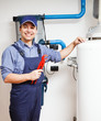 Smiling plumber at work
