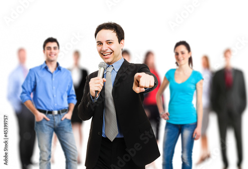 Photo: Man holding a microphone Man holding a microphone