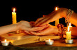 reading the lines hand in a woman's hands on black backcground