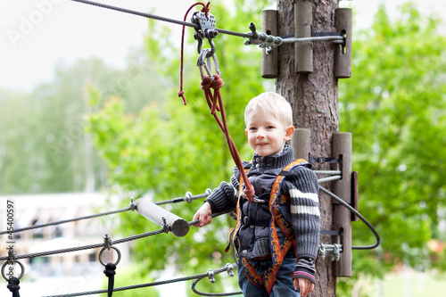 Photo: little boy at a canopy tour little boy at a canopy tour