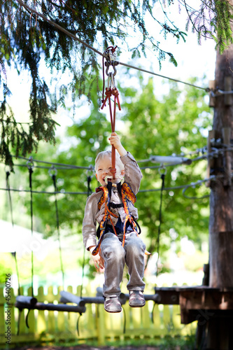 Photo: little boy ziplining little boy ziplining