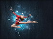 Young woman in gymnast suit posing