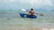 Woman kayaking at tropical sea