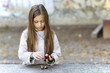 Autumn girl with chestnuts