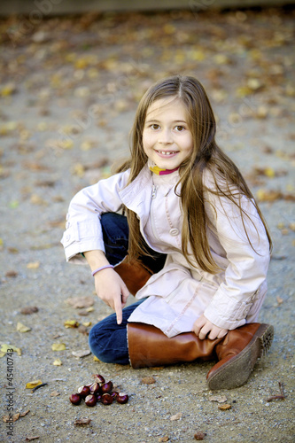 Photo: Child with chestnuts Child with chestnuts