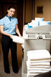Housekeeping in charge pulling out the bath towel