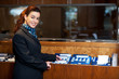 Front office female assistant checking customer records