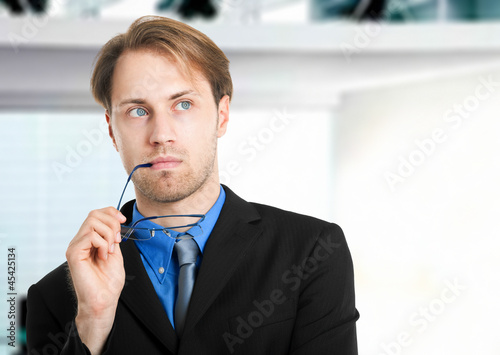 Photo: Pensive businessman in his office Pensive businessman in his office