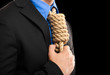 Businessman with a rope in place of a collar: tax pressure