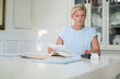 Young woman checking bills and doing budget at home